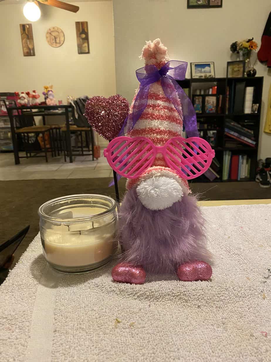 Embellished gnome with glasses, heart pick feet, and heart balloon. Added ribbon onto hat too!