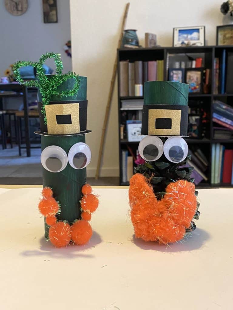 Toilet paper tube and pine cone leprechauns together
