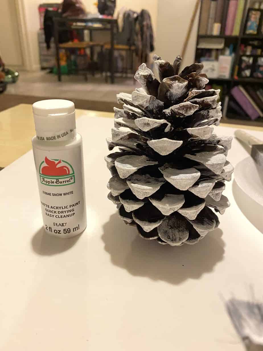 Paint the pine cone white for the lamb painted pine cone Peeps Easter craft 