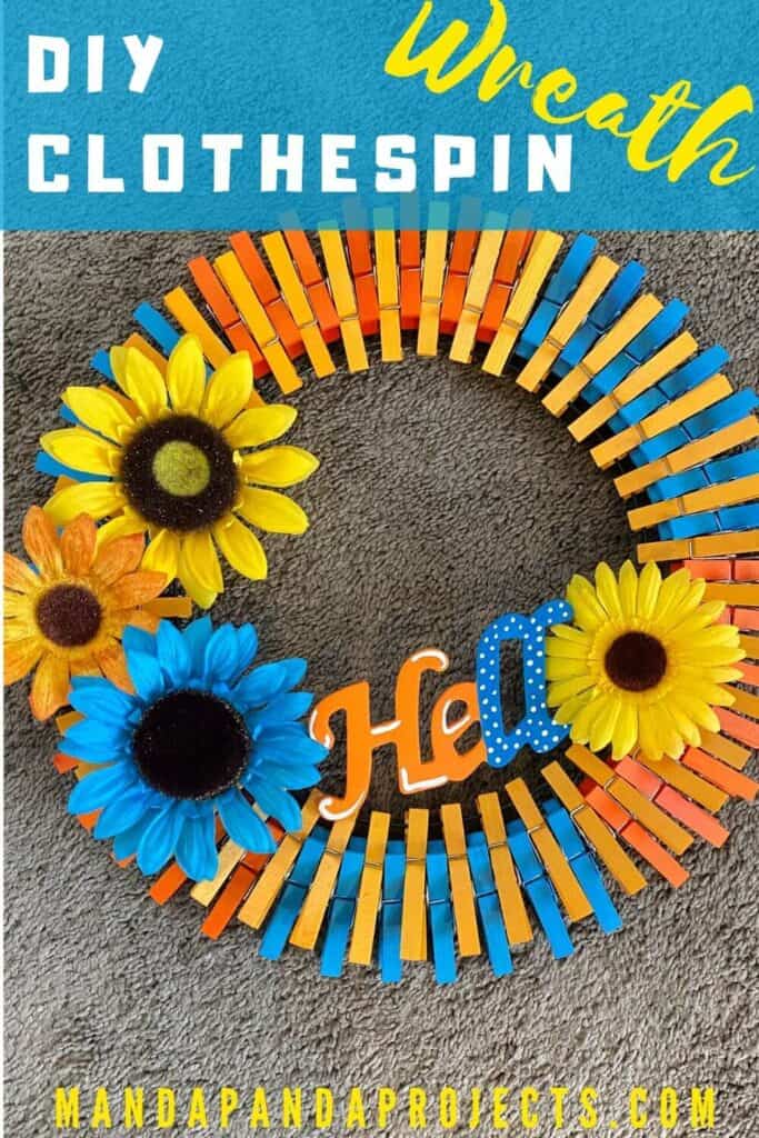 Yellow, blue, and orange "hello" summer sunflower DIY clothespin wreath finished. Pin image