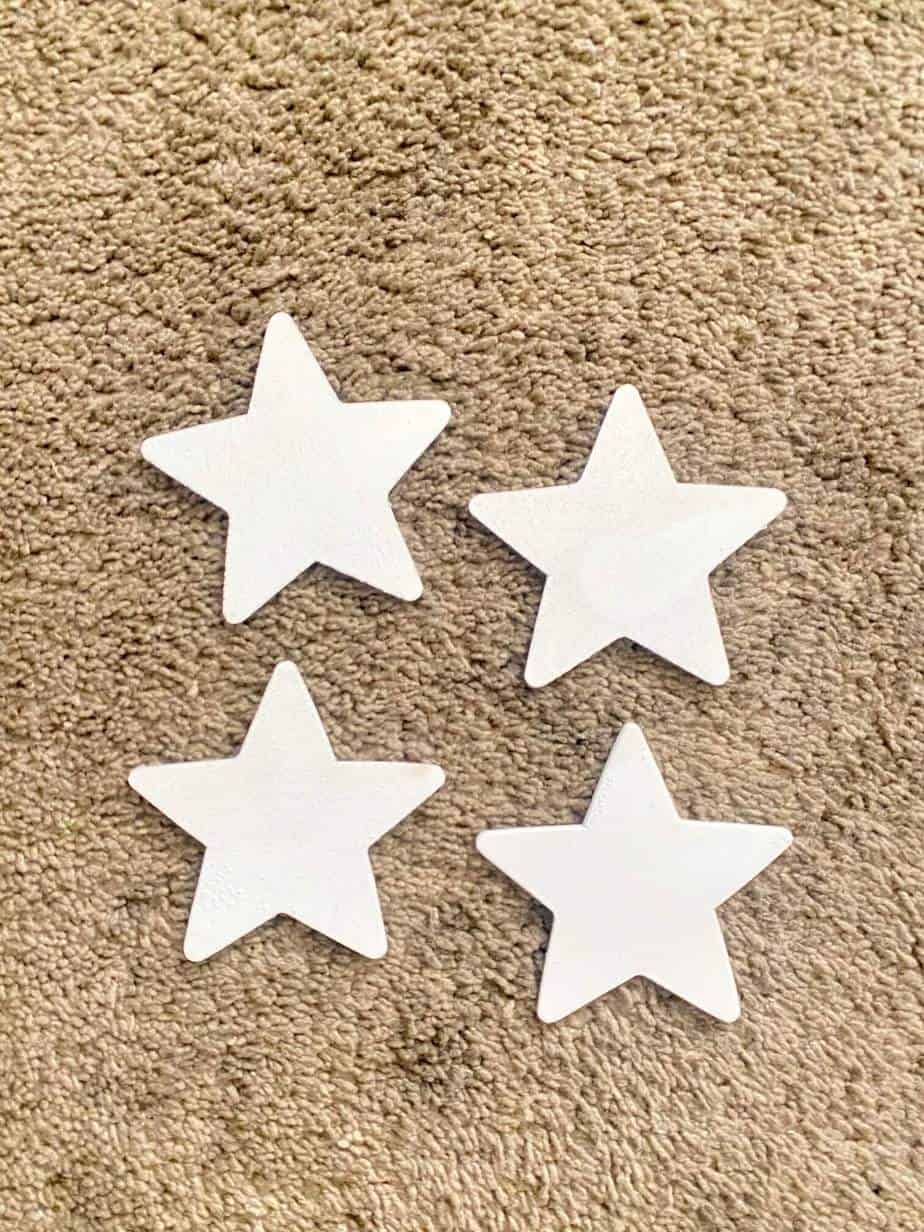 Paint the wooden stars white before attaching to your patriotic clothespin wreath