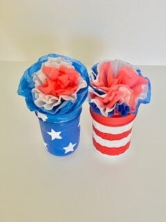 Place the patriotic coffee filter flowers on top of the stars and stripes painted mason jars