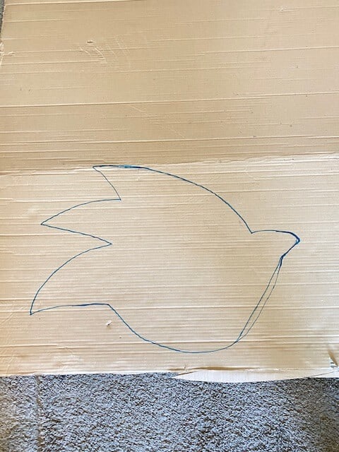 Draw the outline of the front of Sonic onto the cardboard