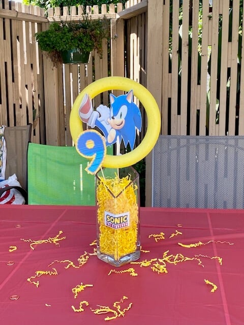 DIY sonic the hedgehog centerpiece made from dollar tree DIY sonic golden rings for a birthday party.