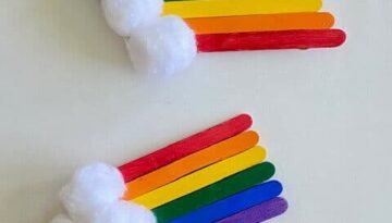Glue cotton balls to one end of the popsicle stick rainbow