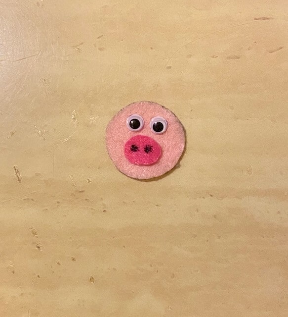 Make the pine cone pigs face out of pink felt and googly eyes