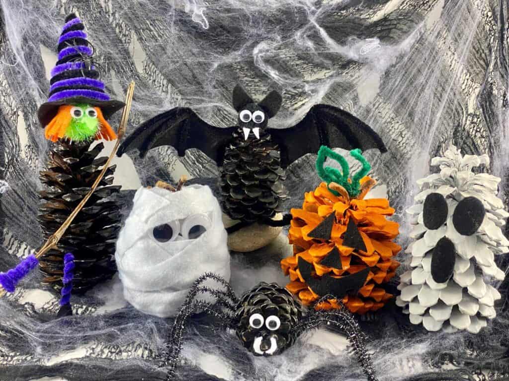 Halloween pine cone nature crafts, ghost, mummy, pumpkin, bat, spider, witch.