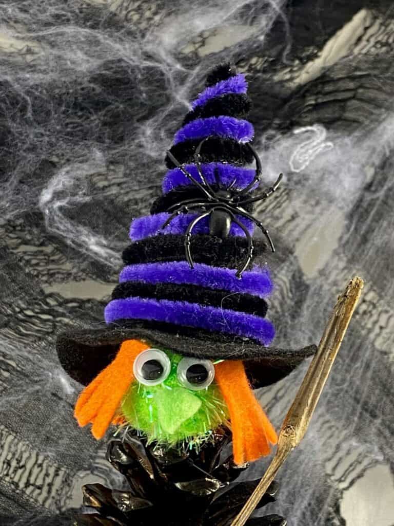 Halloween pine cone witch, kids nature craft. Witches hat with spider
