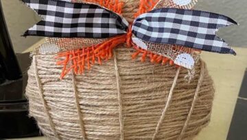 Dollar tree DIY mini twine pumpkin fall craft with an orange burlap, buffalo check, white polka dot burlap ribbon.