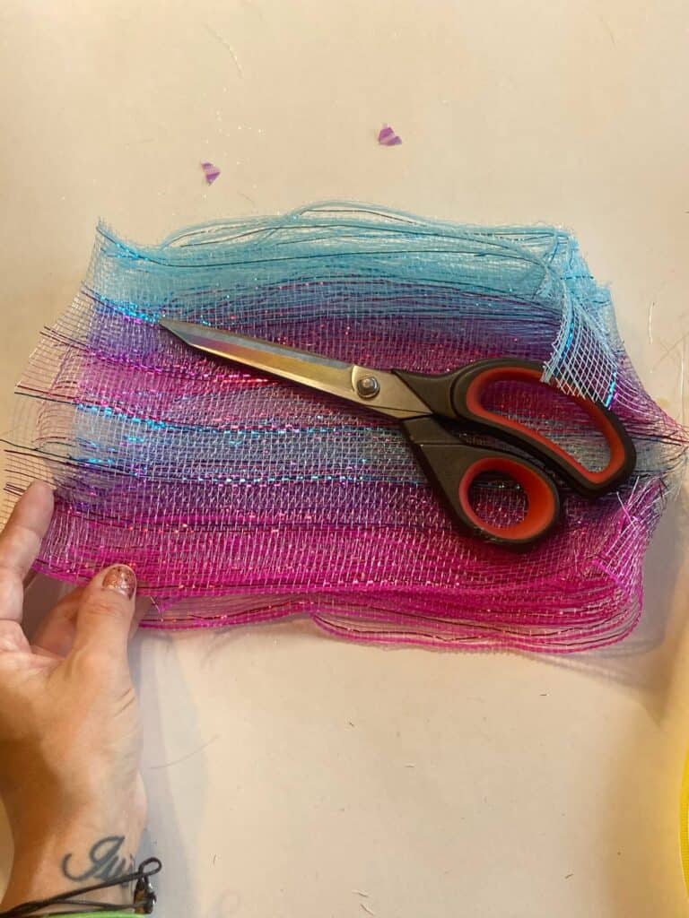 Cut the pink and blue ombre deco mesh into long strips, about 5-8 inches long