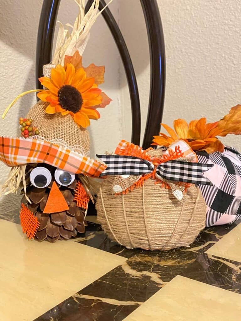 Dollar tree DIY mini twine pumpkin fall craft. Looks cute next to the Buffalo Check  fabric pumpkin and the Pine Cone Scarecrow.