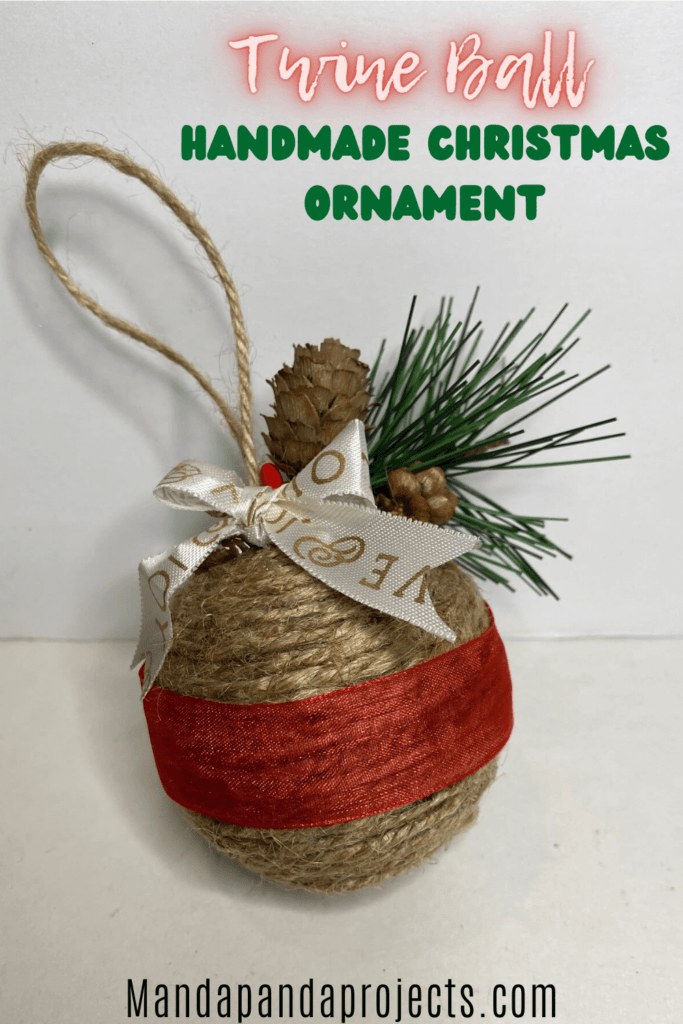 Handmade DIY Twine Wrapped Ball Christmas Tree ornament made with leftover supplies from your craft stash and a pine cone berry sprig on top.