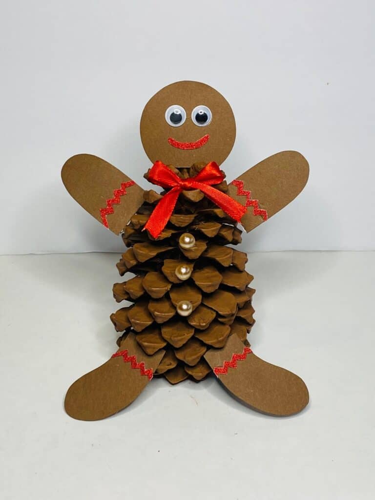 Completed craft project. Pine Cone Gingerbread man. 