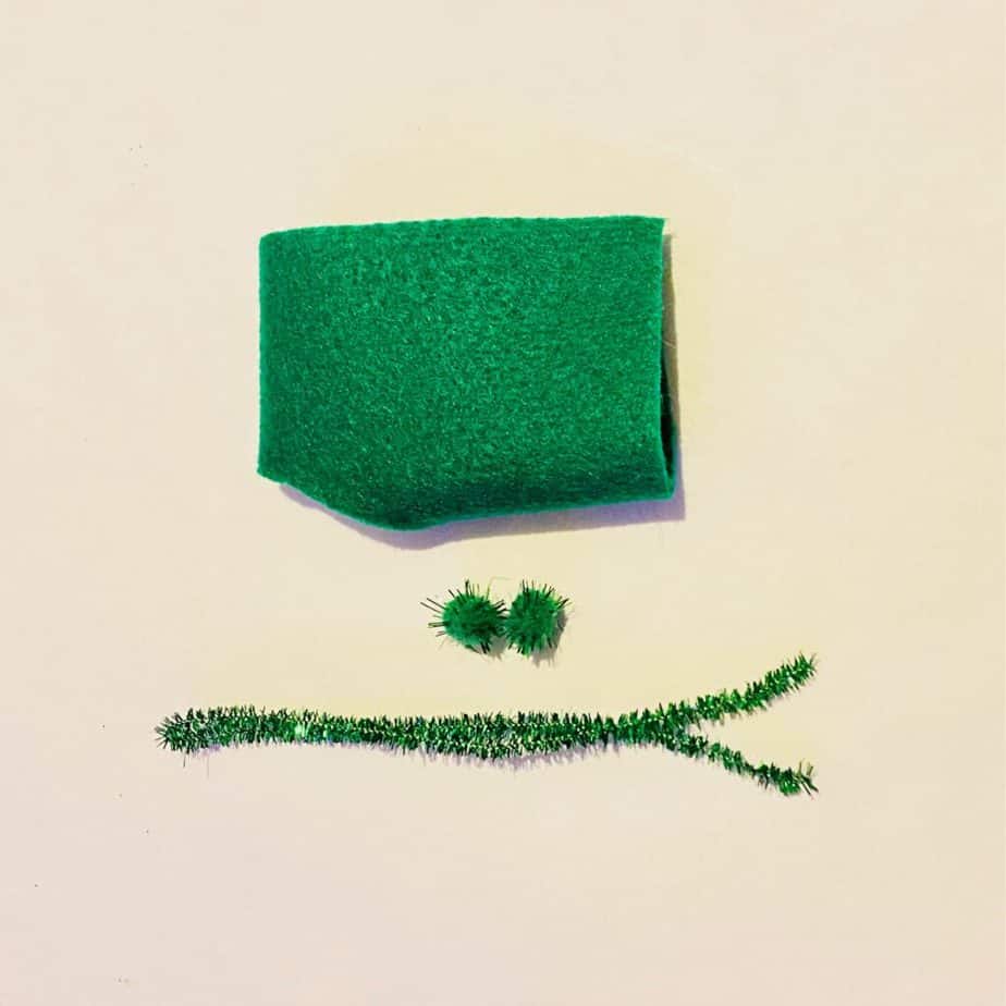 Green felt square, green sparkly pipe cleaner, 2 small green sparkly craft pom poms.