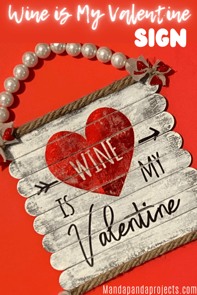 Wine is my Valentine DIY sign made with popsicle sticks for Valentines Day decor with a Pearl Bead hanger.