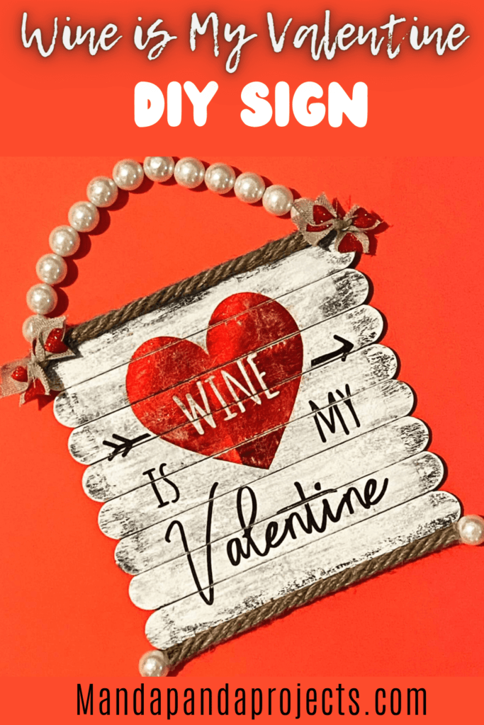 Wine is my Valentine DIY sign made with popsicle sticks for Valentines Day decor with a Pearl Bead hanger.