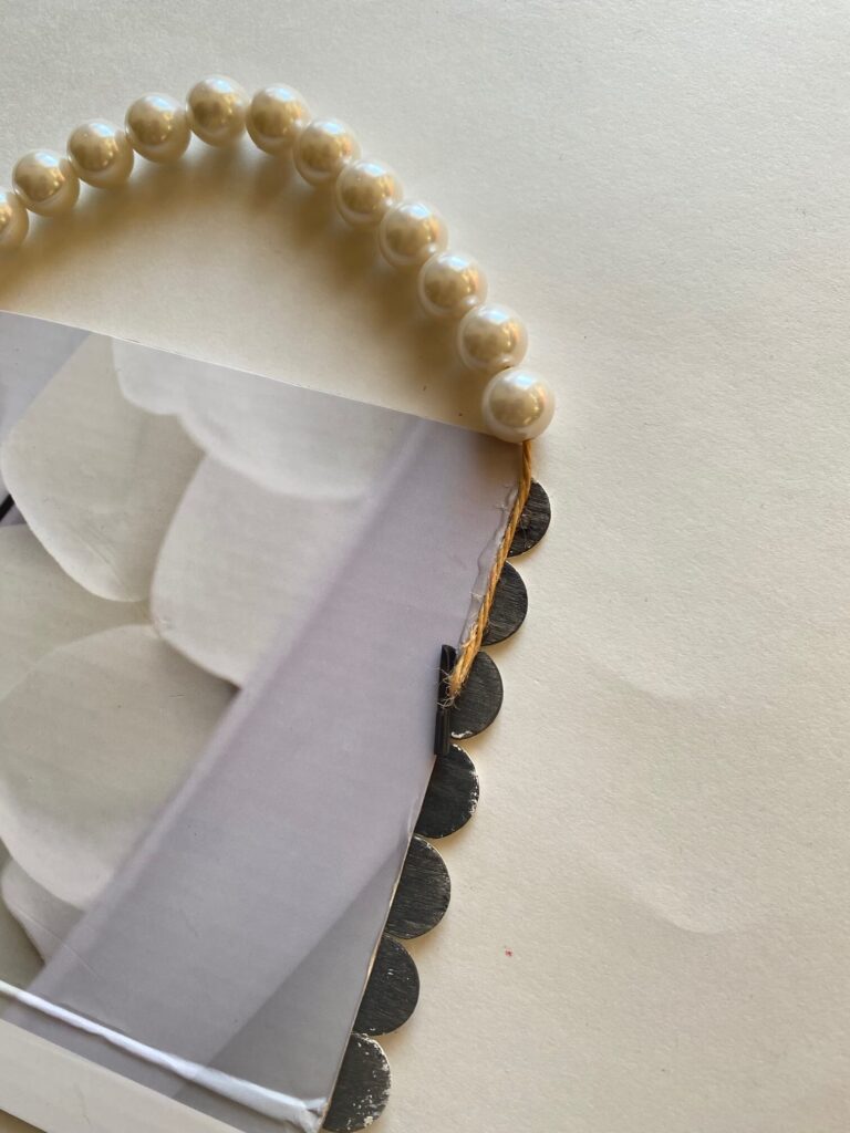 Pearl bead hanger glued to the back of the cardboard Valentine sign.