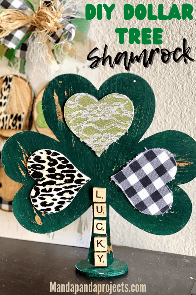 DIY Dollar Tree Wooden Shamrock makeover for a St. Patrick's Day Craft and decor Project, with the word "Lucky" in scrabble tile letters down the stem.