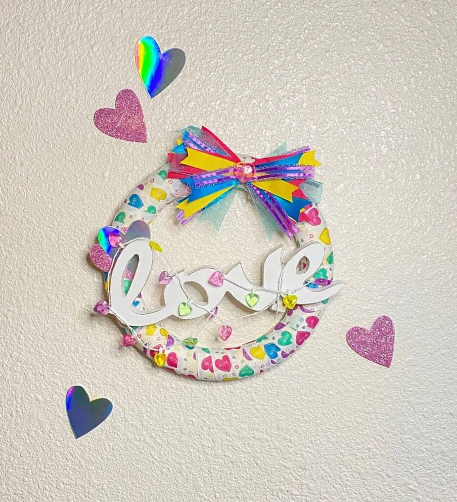 Fun and colorful Dollar Tree Conversation Heart Napkin Foam Wreath for a Valentines Day craft decor for your home.