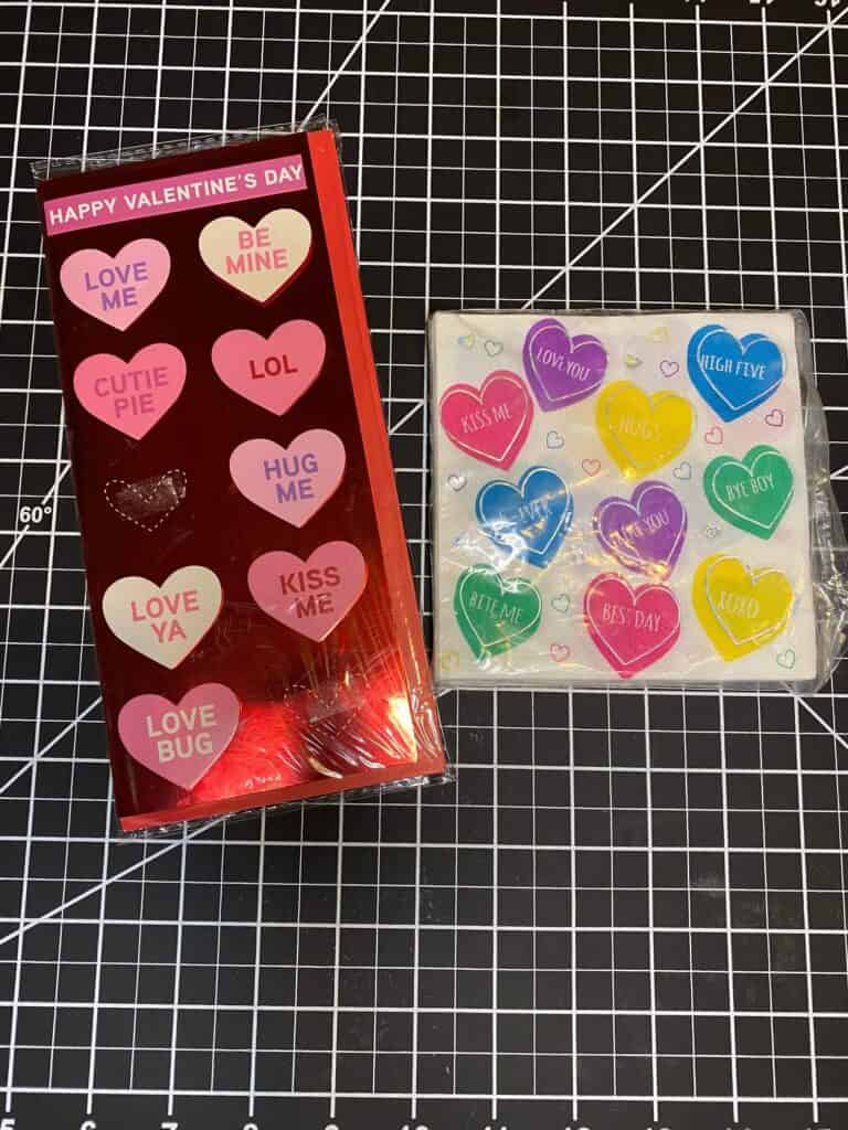 colored Conversation heart Valentine's card next to conversation heart napkins.