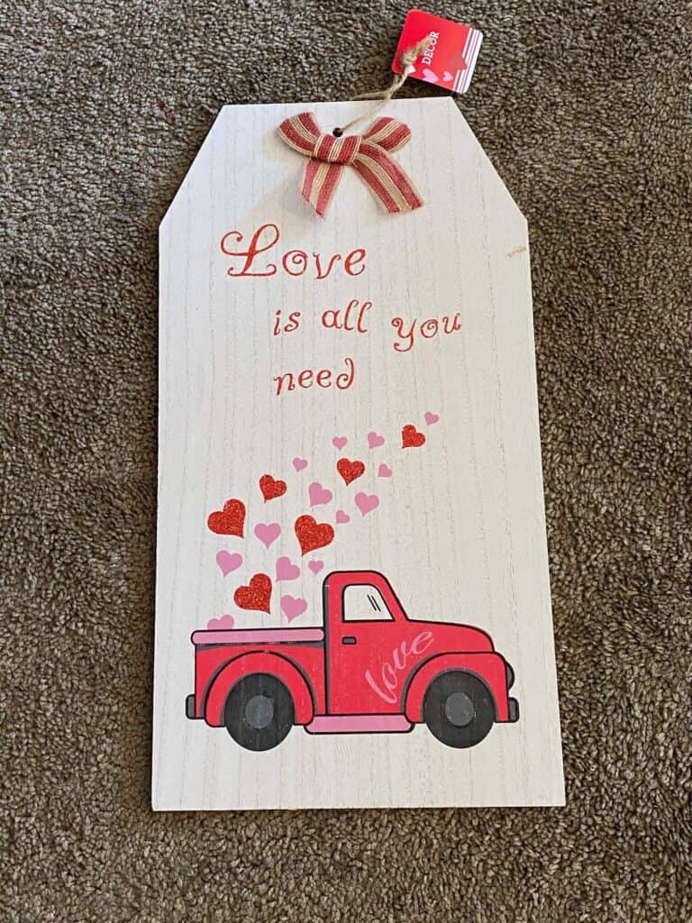 The front of a Dollar valentine truck sign that we are going to use the back of to make the door hanger.