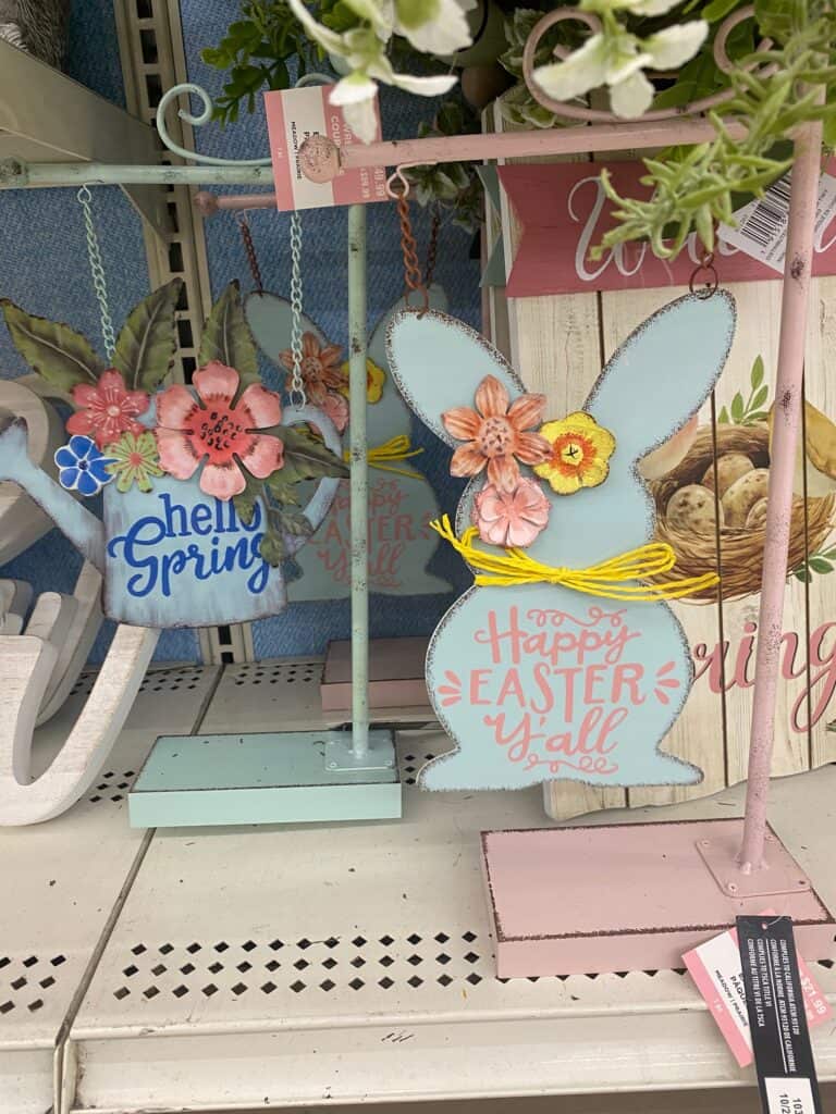 Watering can and Bunny Spring Easter decor sitting on Craft store shelves.