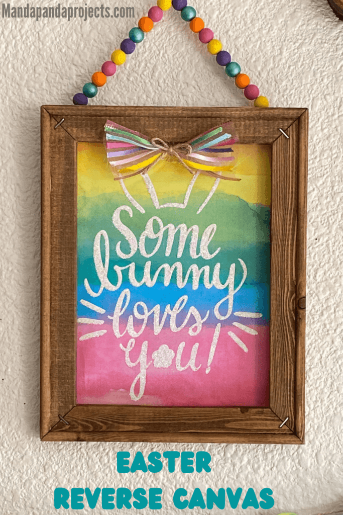 Some bunny loves you easter gift bag reverse canvas DIY decoration with rainbow color wood bead hanger and a small bow.