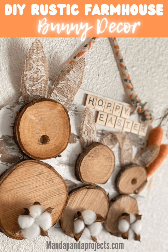 DIY rustic farmhouse wooden Easter bunny decor craft project with burlap ears, cotton pod tails, twine carrots, and 'Hoppy Easter' message in scrabble tiles, hanging with a carrot ribbon.