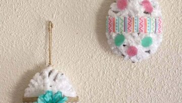 DIY Dollar Tree Tinsel egg makeover. 3D Easter Eggs decorated and wrapped with white yarn.