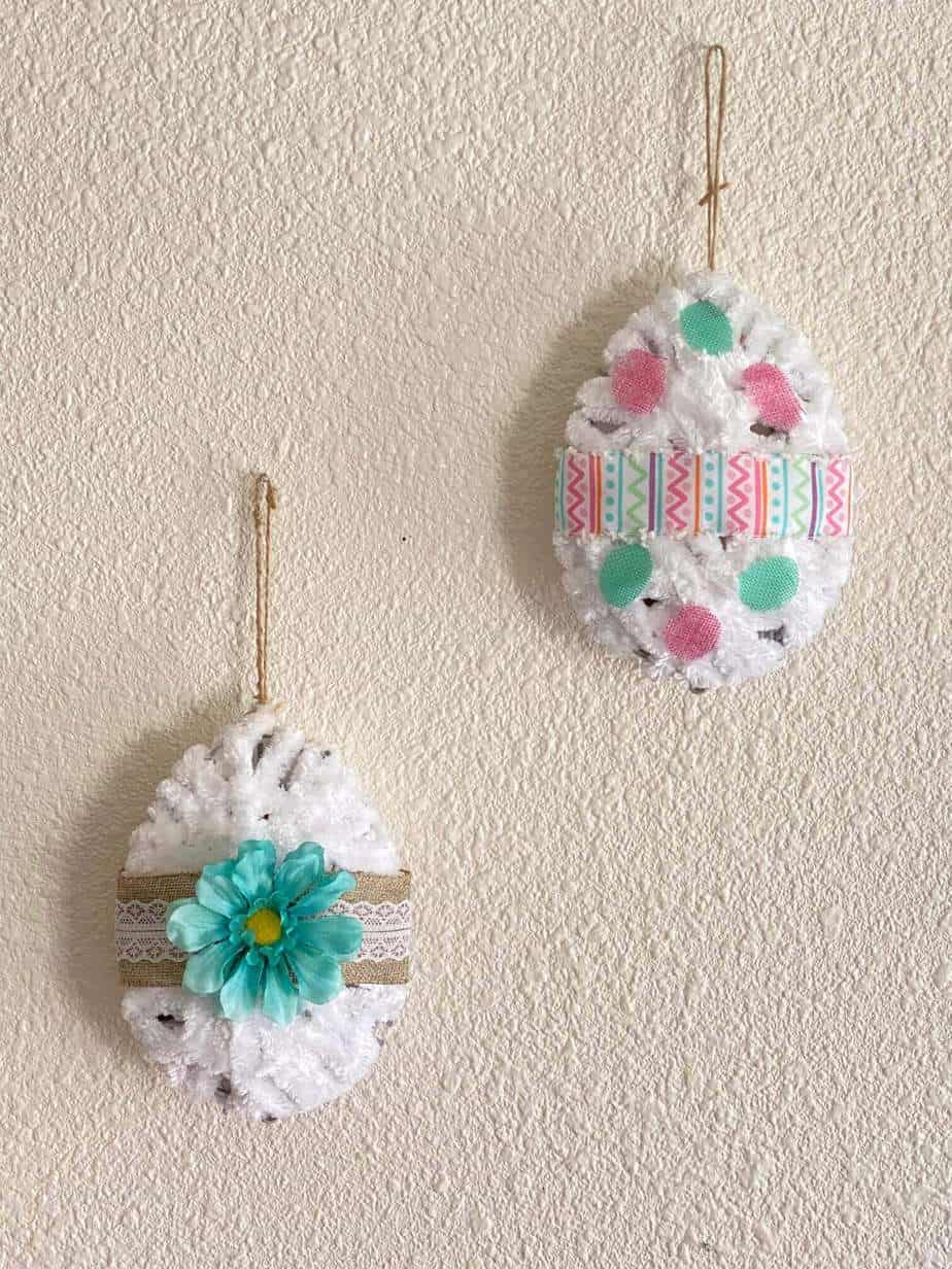 DIY Dollar Tree Tinsel egg makeover. 3D Easter Eggs decorated and wrapped with white yarn.