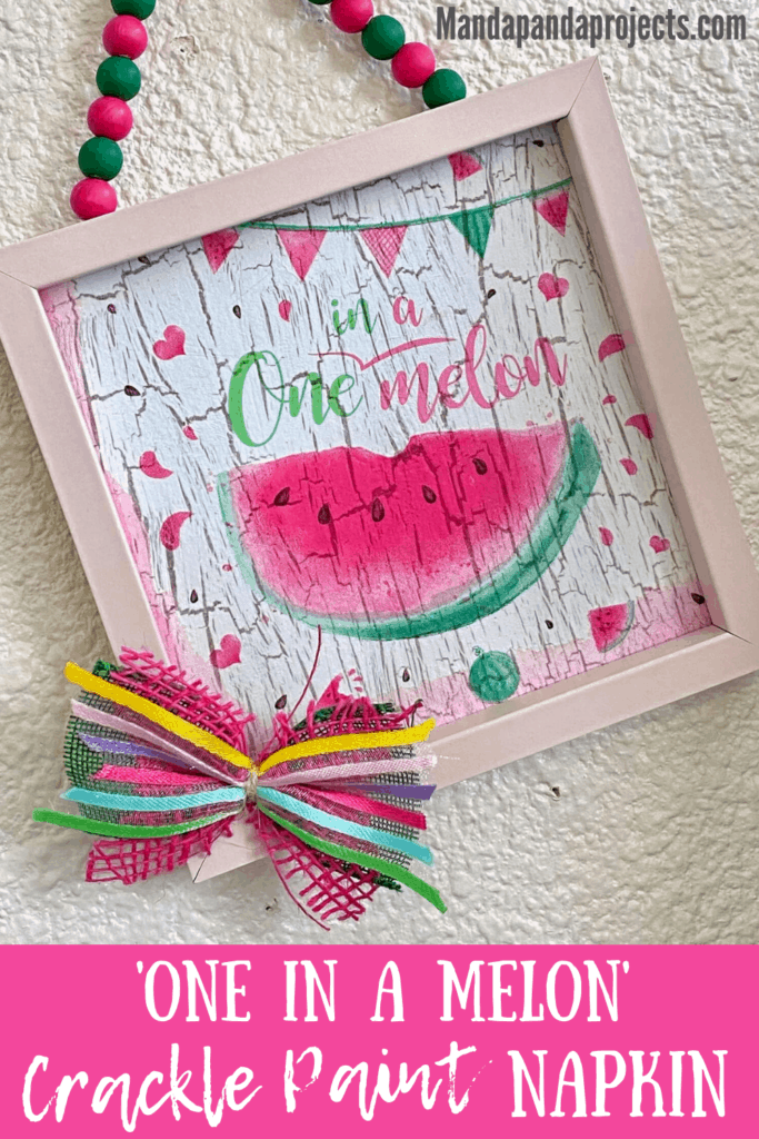 One in a melon summer watermelon napkin in a Dollar Tree frame, mod podged on top of the crackle paint technique with a pink and green wood bead hanger and a small decorative bow. Summer DIY crafts.