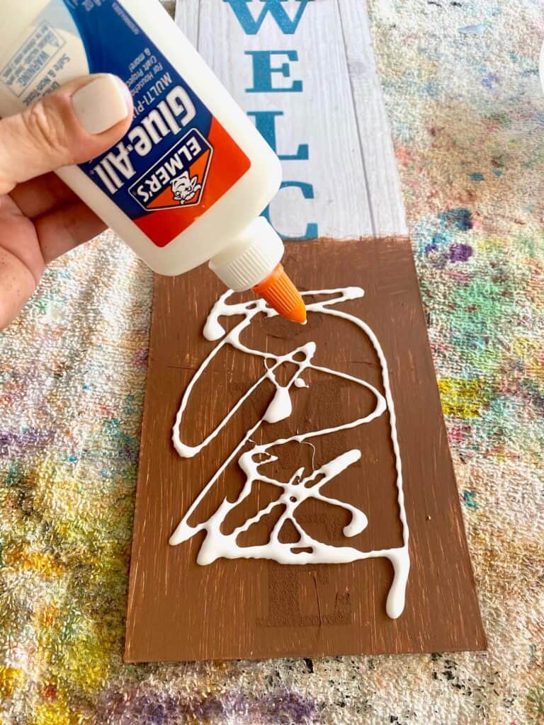 Apply a generous layer of Elmer's school glue to the surface, and spread out evenly.