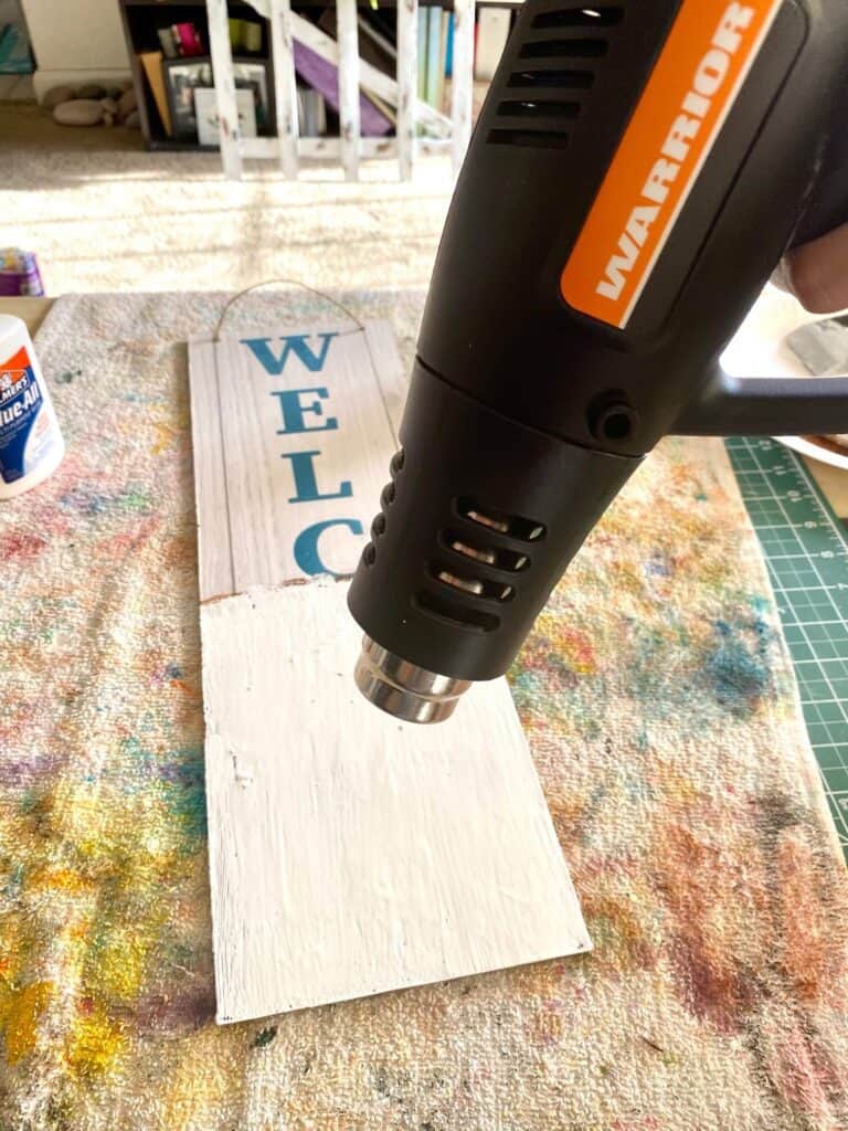 Dry the surface of the glue and paint with a heat gun or blow dryer and watch the magic happen as the paint crackles.