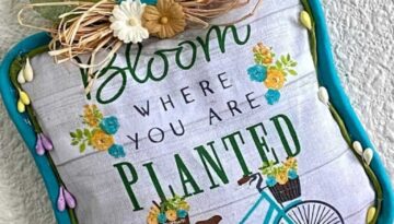 Dollar Tree 'Bloom Where you Are Planted' Pot Holder DIY Doorknob Hanger with a raffia bow and wood bead hanger.