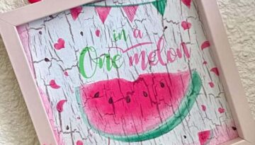 One in a Melon, watermelon summer napkin mod podged on top of the crackle paint technique with a wood bead hanger and mini pink and green bow.