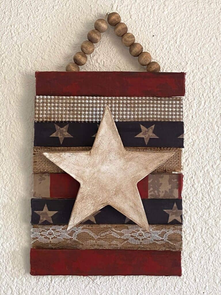 Antiqued and rustic Patriotic star with stars and stripes, burlap, lace, and pearl and a wood bead hanger for Memorial day or July 4th DIY Decor.