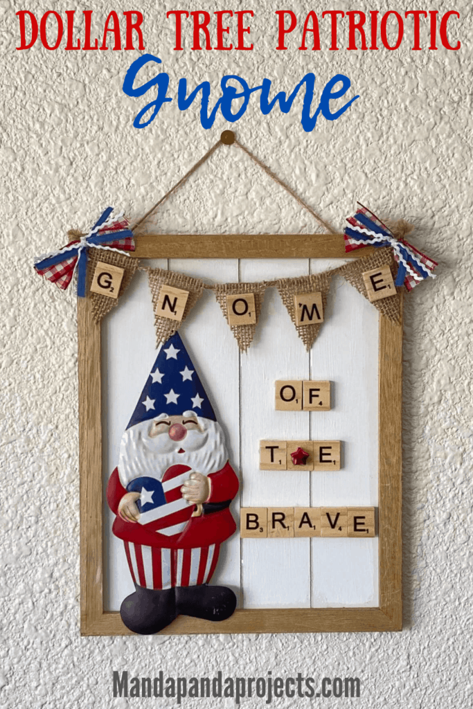 Dollar Tree patriotic gnome DIY sign that says "Gnome of the Brave" on a mini burlap pendant banner with a gnome holding a red white and blue heart, and wearing stars and stripes.
