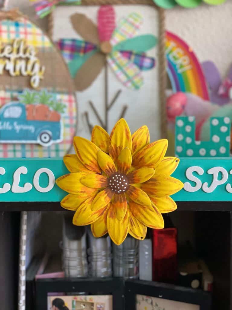 Close up of the Dollar Tree Sunflower painted and glued to the Dollar Tree Long Teal wooden board.