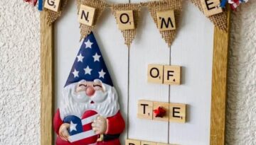 Dollar Tree patriotic gnome DIY sign that says "Gnome of the Brave" on a mini burlap pendant banner.