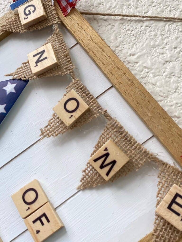 Close up of the "Gnome of the Brave" sign on a mini burlap pendant banner.