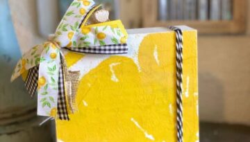 Dollar Tree Lemon Napkin Shelf Sitter. DIY tiered tray decor.