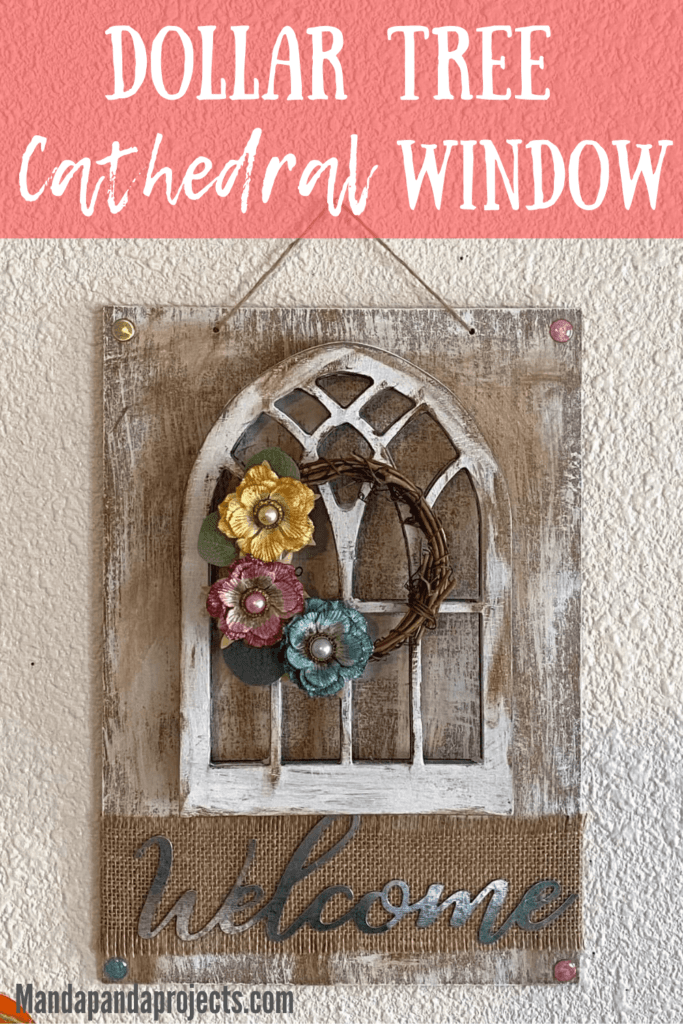 DIY Dollar Tree Cathedral window decor craft with a mini grapevine wreath and scrapbook embellishment flowers and a galvanized metal Welcome sign.