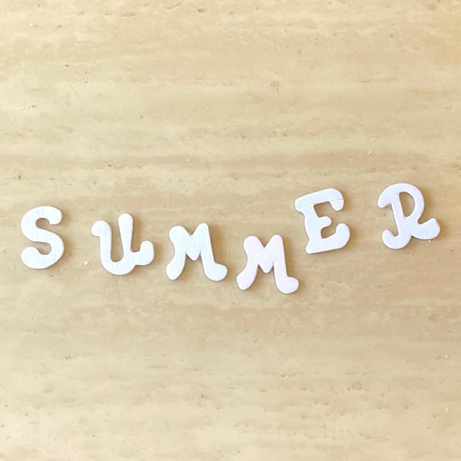 Wooden letters that spell summer painted all white.