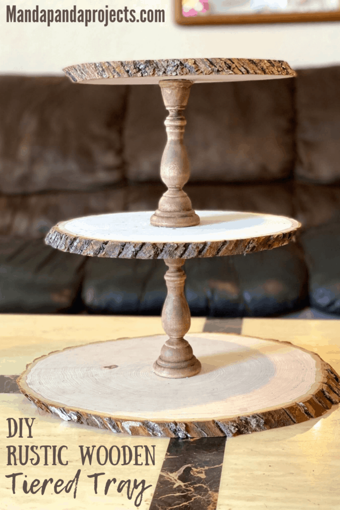 DIY Rustic wooden round 3 tiered tray with natural wood and stained wooden candlesticks.