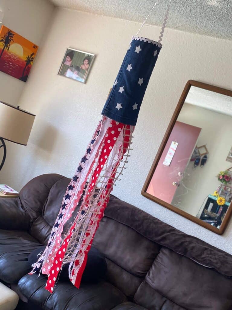 DIY Patriotic Red, white, and blue jeans, American flag windsock for the Fourth of July. DIY crafts and July 4th decor.