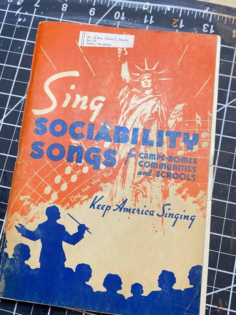 Sing Sociability sings for camps-homes communities and schools, keep America singing, orange book that the music sheets came out of.