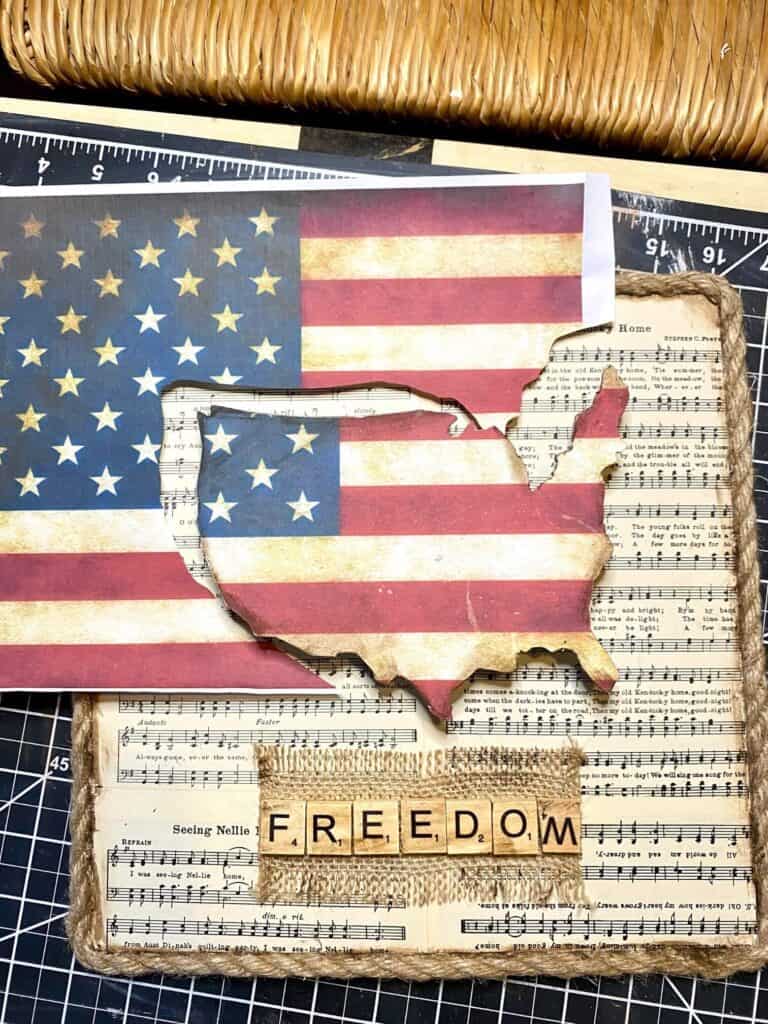 Cut out the USA shape out of American flag paper and mod podge it to the wooden USA>