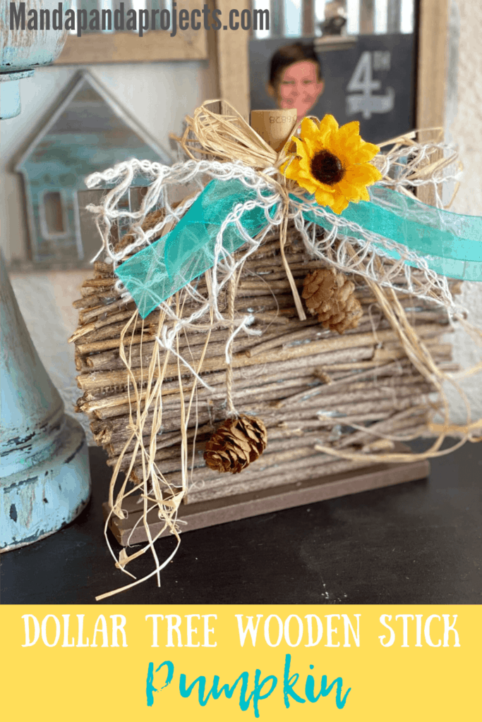 DIY Dollar Tree Rustic Country Wooden Stick Pumpkin Makeover with teal lattice bow and sunflower and pine cone embellishment for fall  diy crafts and decor.