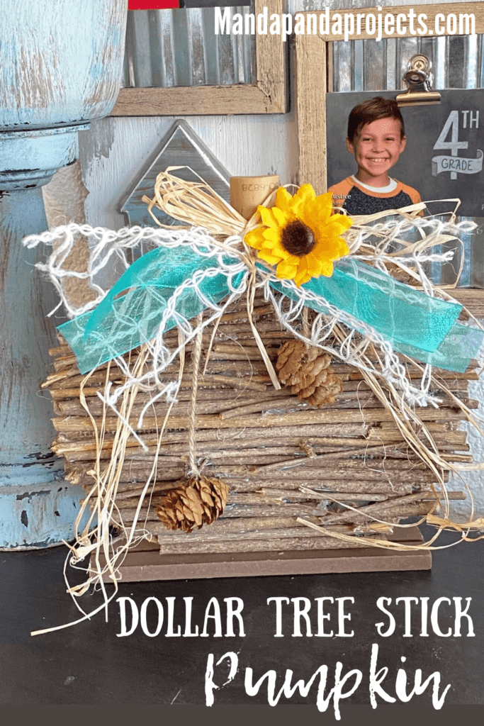 DIY Dollar Tree Rustic Country Wooden Stick Pumpkin Makeover with teal lattice bow and sunflower and pine cone embellishment for fall  diy crafts and decor.