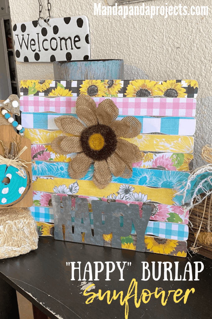 "happy" burlap Sunflower made with Hobby Lobby pink, teal, and yellow Sunflower scrapbook paper and a galvanized metal word "happy" for beautiful crafty decor that works for Spring, Summer, or even Fall. 